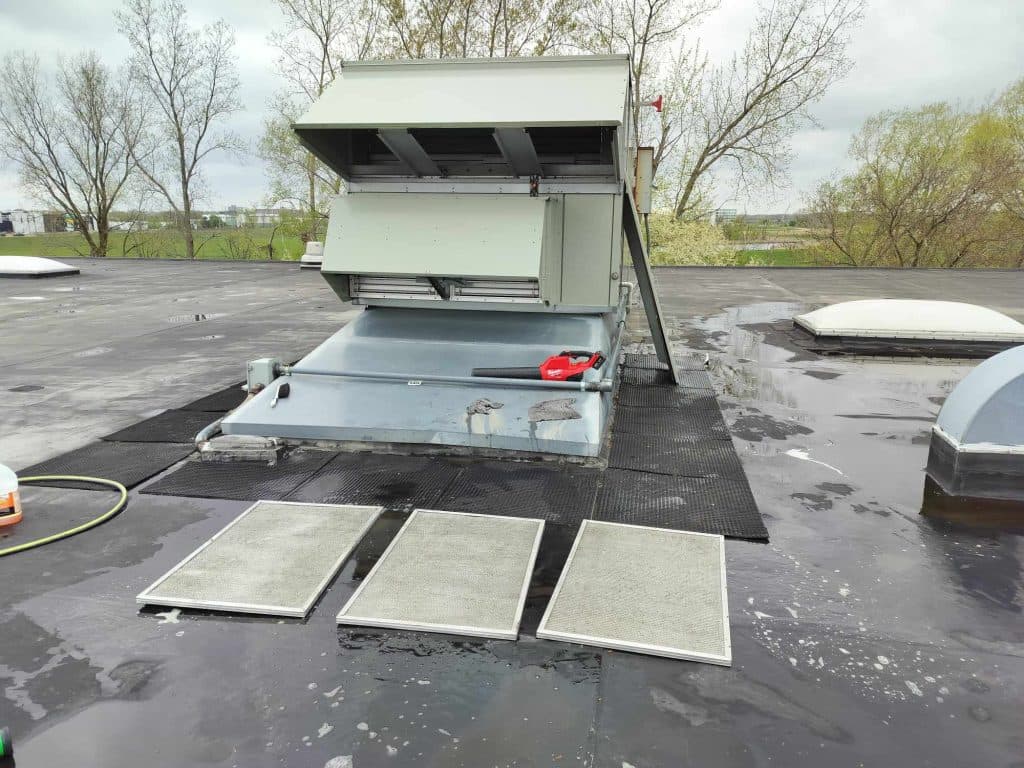 Rooftop RTU with filters pulled for cleaning during an AMW seasonal maintenance visit